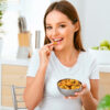 A woman enjoying Natural Dried Mangos