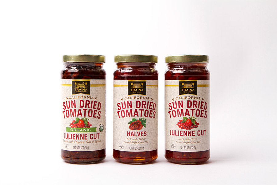 Picture of Traina Home Grown Sun Dried Tomatos in jars.